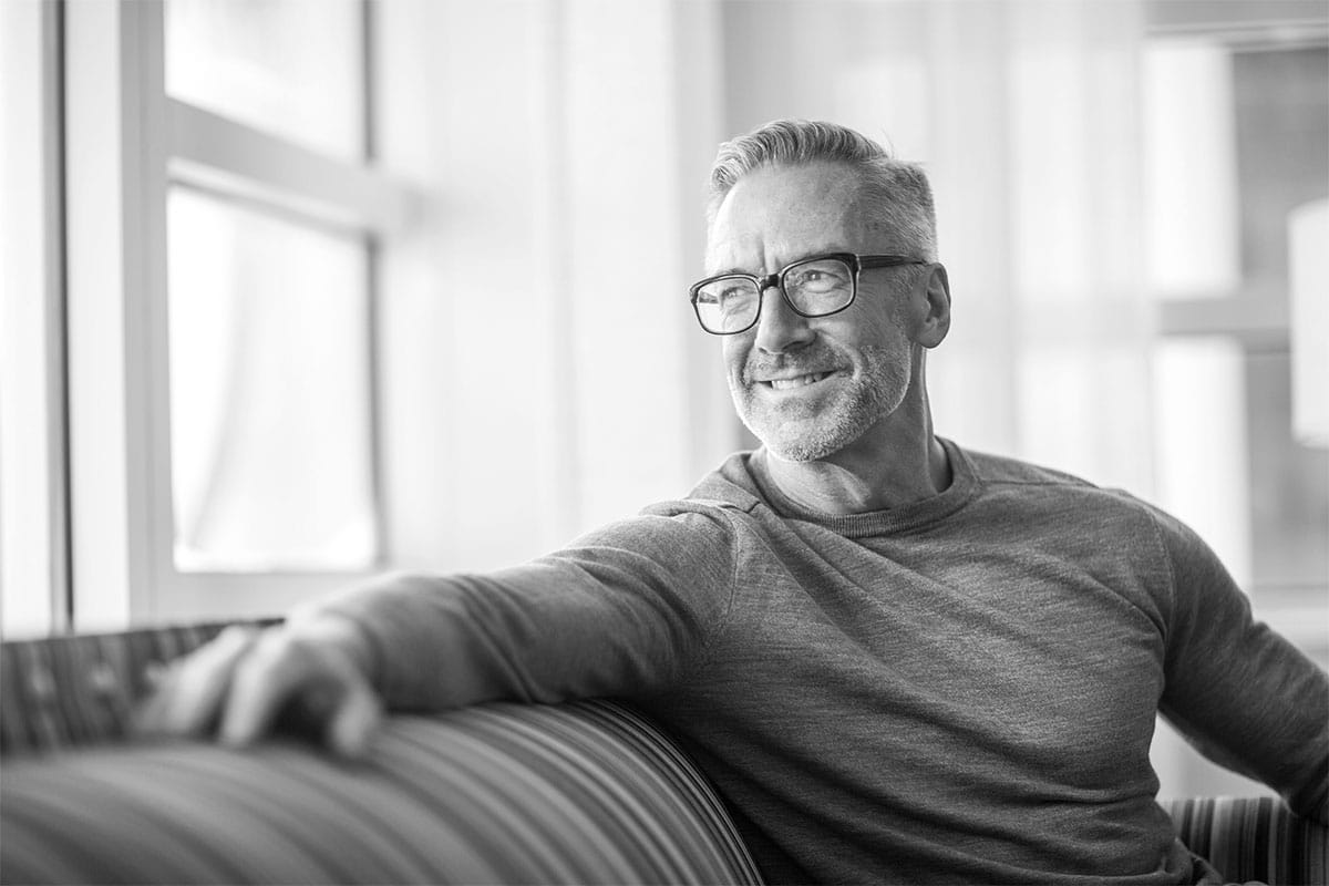 A man smiling after hormone replacement therapy in Gloucester County.